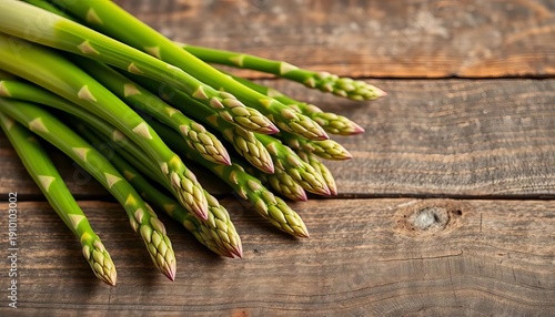 Fresh green asparagus spears on rustic wooden surface, cooking, delicious