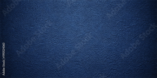 A dark blue grunge background with a rough textured denim fabric pattern and vintage leather material surface for a deep blue wallpaper design