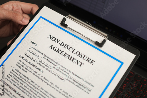 Billede på lærred Close up view showing serious non disclosure agreement document clipped on clipb