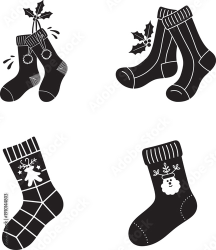 Four pairs of festive black and white socks with holiday