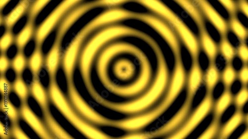 Vibrant yellow spiral pattern with concentric circles and optical illusion effect.