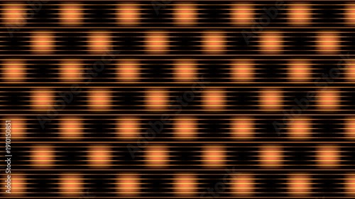 Blurry orange dots on a black background forming a pattern.