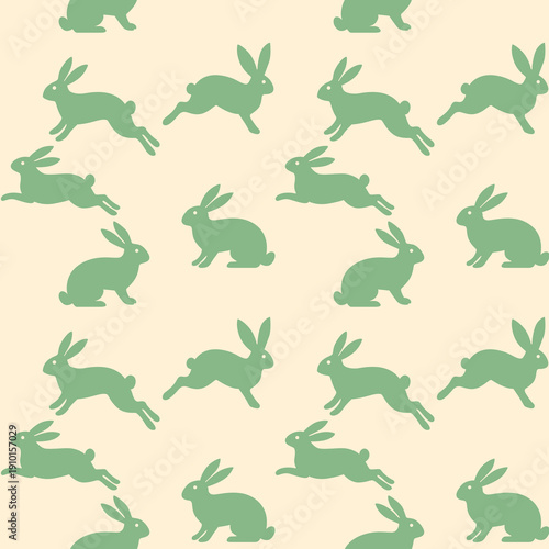 Seamless repeat pattern featuring sage green bunny silhouettes on a soft cream background. Elegant Easter and spring design for fabric, nursery decor, wallpaper and wrapping paper.