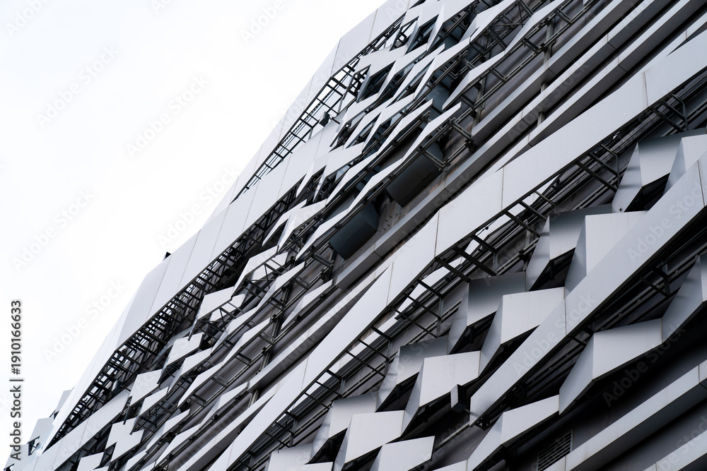 Obraz premium modern Aluminium composite material architecture gray color and Hexagon shape popup texture on exterior facade building.