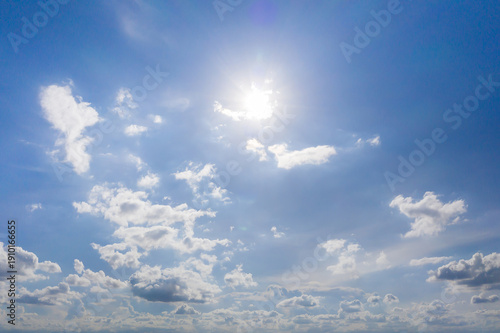 blue sky background with the sun and beautiful white cloud nature background, idea for website or wallpaper background.