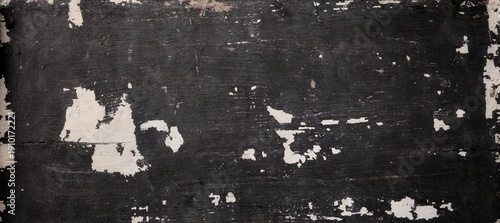 Black distressed wooden texture background with peeling paint and rough surface. Grunge vintage wood wall pattern suitable for dark background, industrial design, abstract texture, and rustic concepts