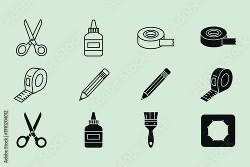 Black and white school office supplies on green background scissors glue bottle tape masking tape