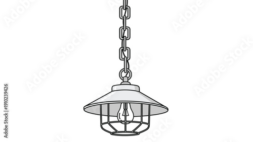 Vintage industrial style pendant lamp with a protective metal cage hanging from a sturdy black chain in a studio.
