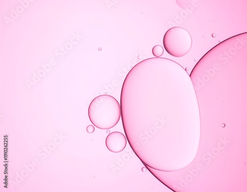 Macro view of pink oil droplets in water
