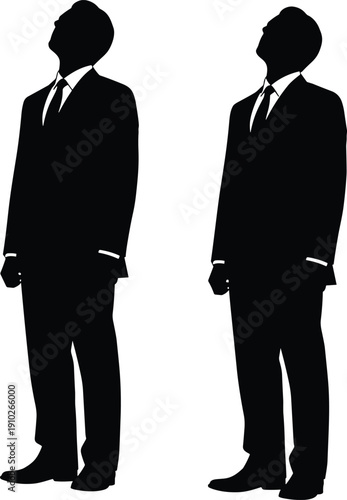Black silhouette of two successful businessmen in formal suits standing and looking up towards the sky on a white background.