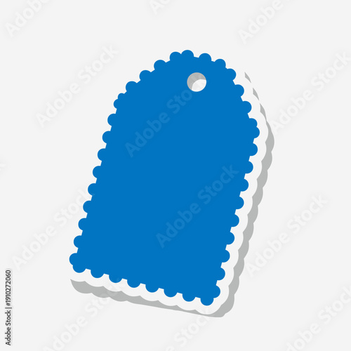 Scalloped blue paper tag with a hole at the top, isolated on a white background, casting a subtle shadow