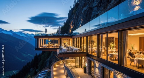 Cliffside restaurant at dusk, large windows, mountain backdrop, dining