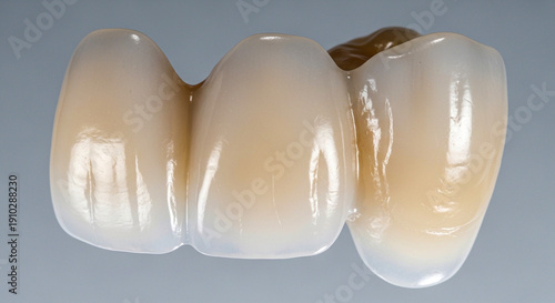 Dental implants with ceramic crowns on gray background