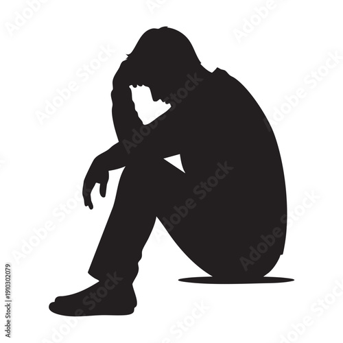 Silhouette of a man in despair feeling hopelessness and sadness