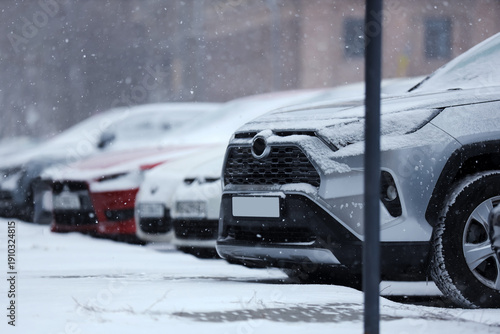 Cars with snow in city on w...