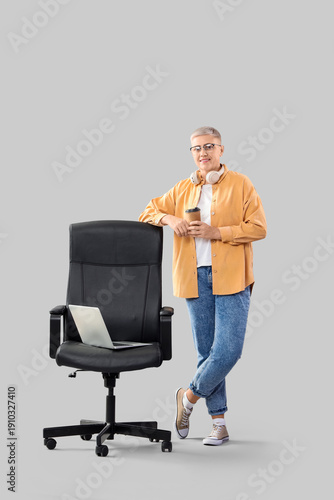 Female programmer with coff...