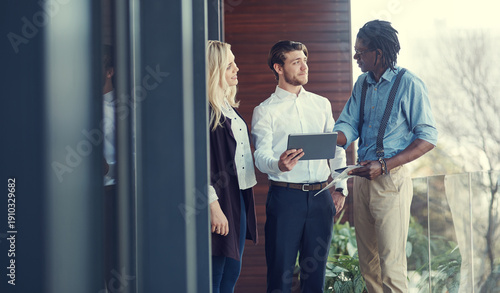 Wallpaper Mural Business people, meeting or talking with tablet on balcony, research or online resources for proposal. Teamwork, brainstorming or group with idea for brand identity, target audience or plan campaign Torontodigital.ca