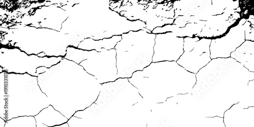 Dramatic overhead view of arid land torn by deep fractures, rough gritty texture highlighting the harsh effects of extreme heat and dryness.