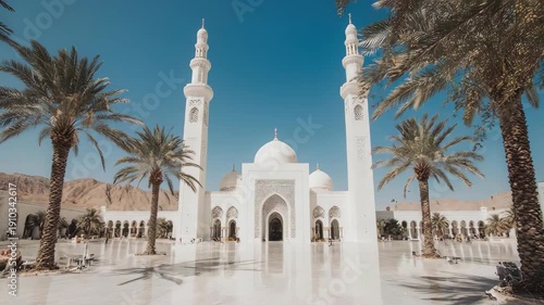 Serene White Mosque with Palm Trees.