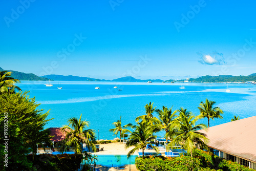 Tableau sur toile A beautiful view of Langkawi island against a beautiful blue sky with  some boats in the distance on the horizon