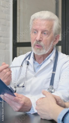 Senior Doctor Sharing Good News with Anxious Female Patient, vertical video