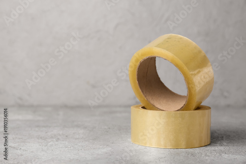 Adhesive tape rolls on ligh...