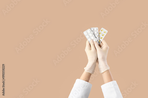 Hands of doctor with pills ...
