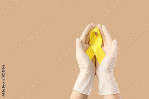 Hands of doctor with yellow...