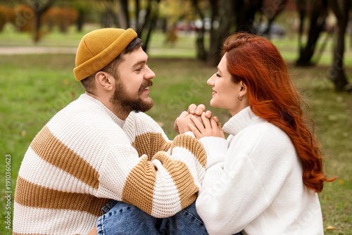 Cute young couple in warm s...