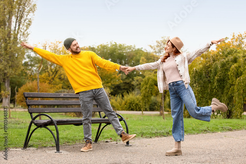 Cute young couple in warm s...