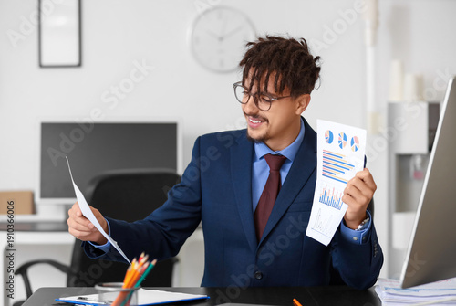Young male bank manager wit...