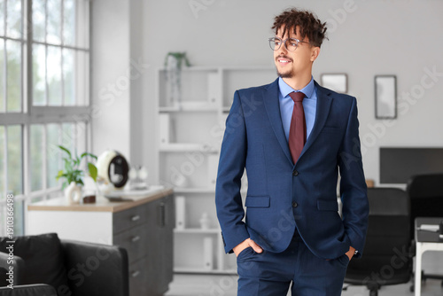 Young male bank manager in ...