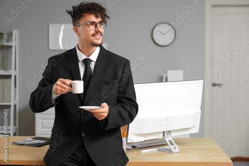 Young male bank manager wit...
