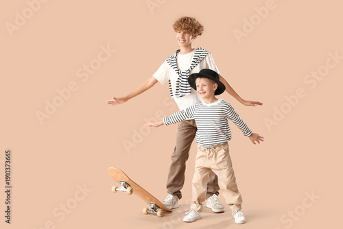 Cute brothers riding skateb...