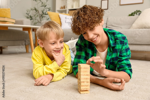 Cute brothers playing game ...