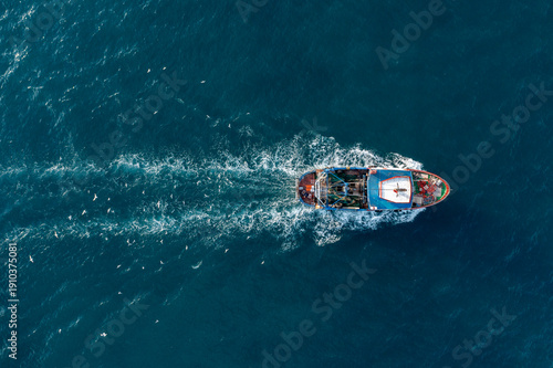Konstfotografi Fish trawlers returning to port highlight the importance of ocean conservation a
