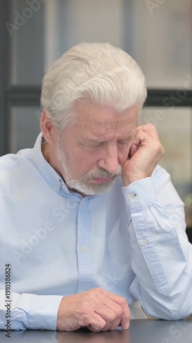 Wallpaper Mural Old Businessman having Headache while Sitting in Office, vertical video Torontodigital.ca