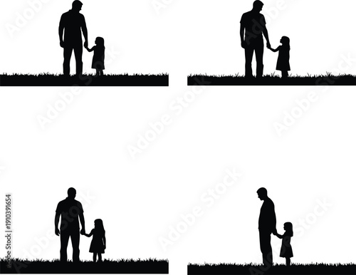 Father and daughter silhouettes holding hands in grass