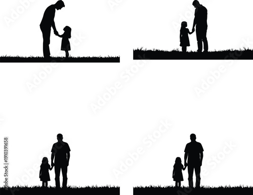 Father and daughter holding hands, walking on grass