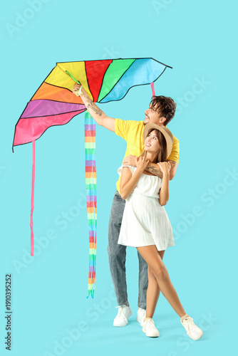 Happy young couple flying c...