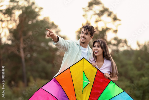 Happy young couple with col...
