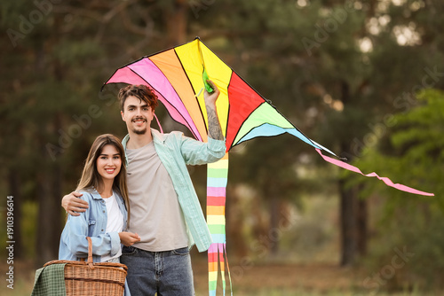 Happy young couple flying c...