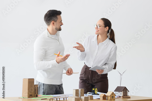 Male architect and his assi...