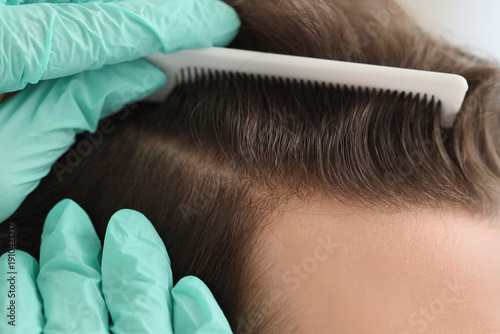 Doctor examining man in cli...