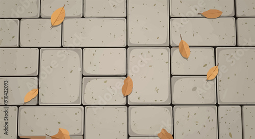 Autumnal fallen leaves scattered across a textured stone pavement pattern
