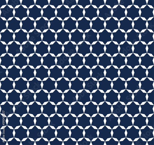 Japanese indigo dyed pattern featuring geometric hexagon shapes. Traditional textile design perfect for apparel, headscarves, wrapping paper, and packaging design. Minimalist, seamless blue texture.