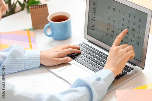 Female hands using laptop w...