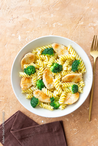 Pasta with chicken and broccoli in a creamy sauce. Italian cuisine.