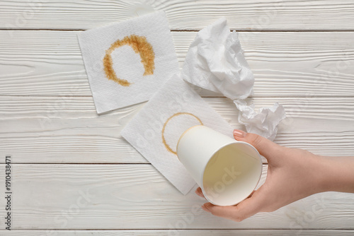 Female hand with paper cup,...