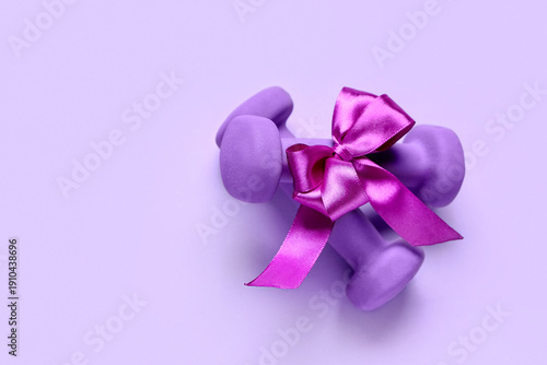 Purple dumbbells tied with ...